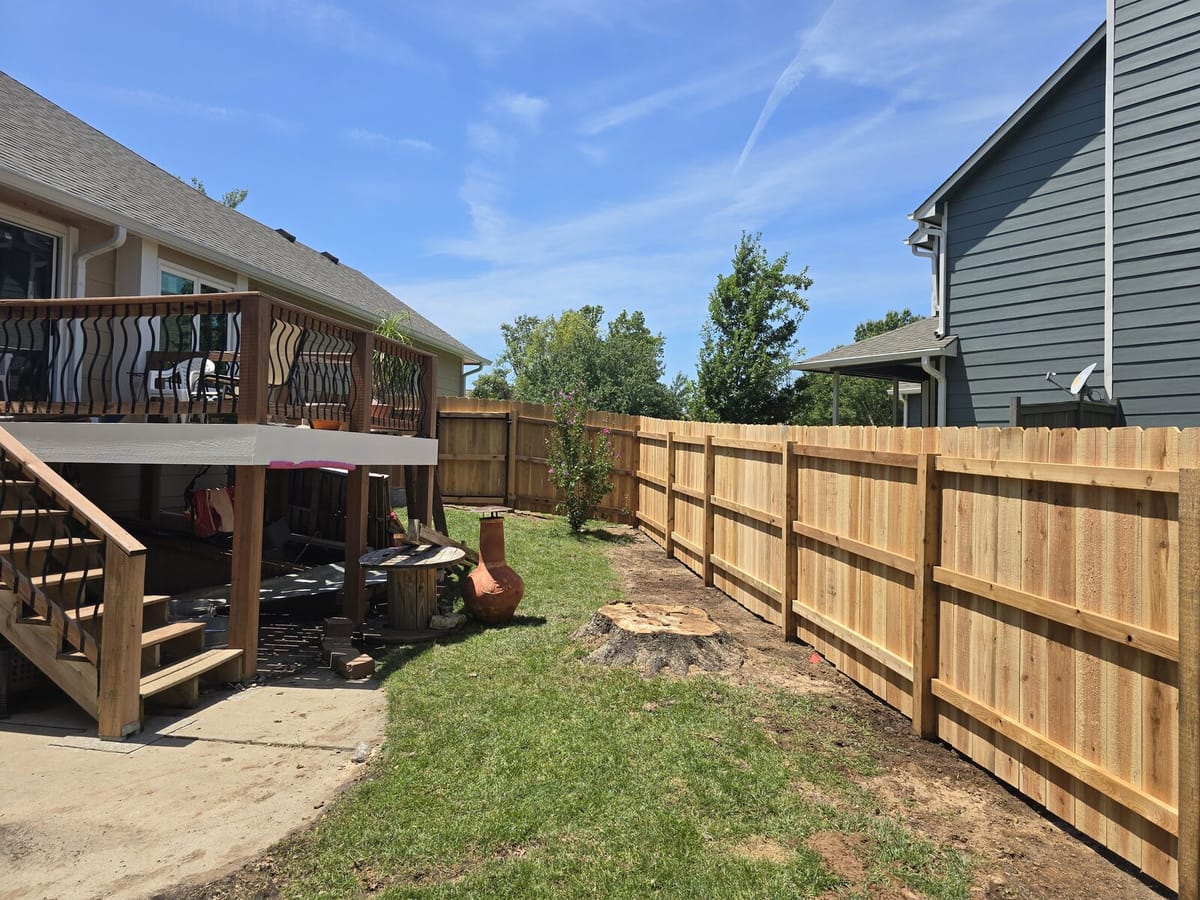 Another angle of the finished cedar privacy fence in the Wichita backyard