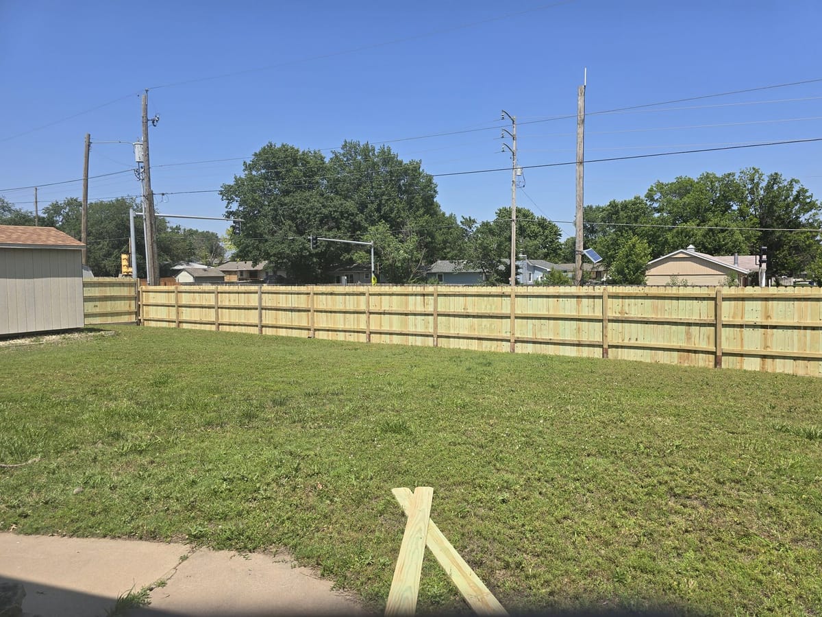 Third view of the open-yard cedar fence install in Wichita